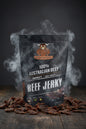 Outback Jerky packaging with beef jerky image on a smokey background